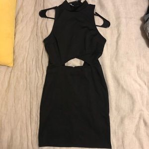 Little black dress with stomach cutout.